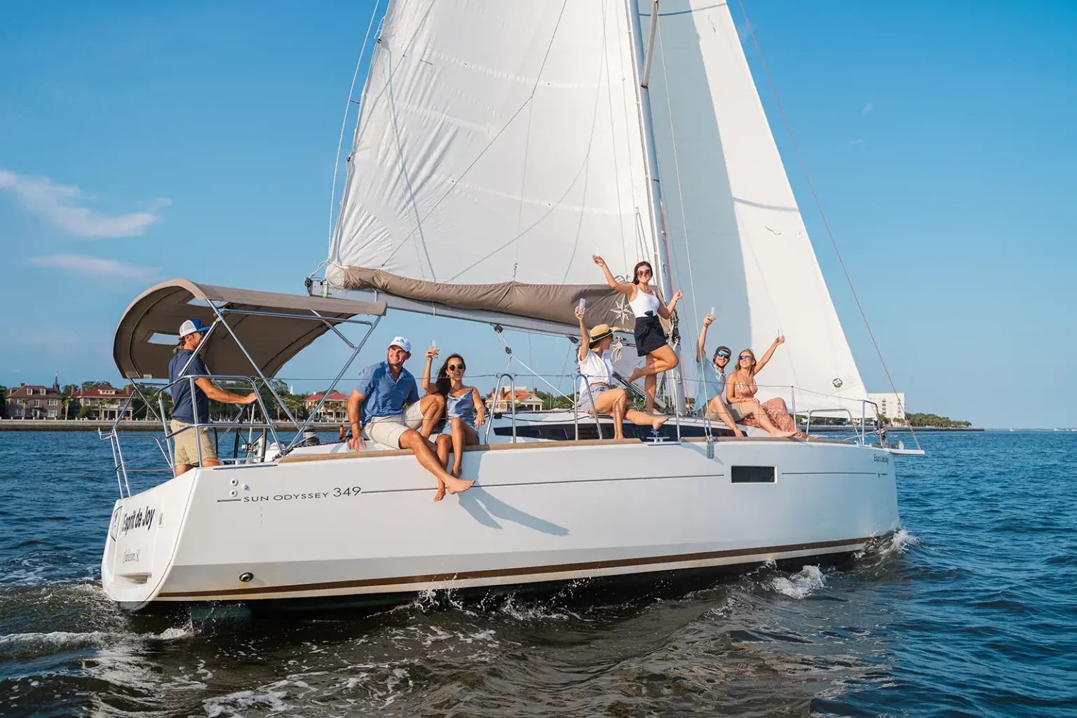 Guests toasting aboard Esprit de Joy on Charleston Harbor