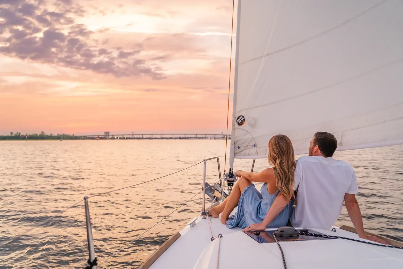 Couple watching the sunset from the bow of Esprit de Joy