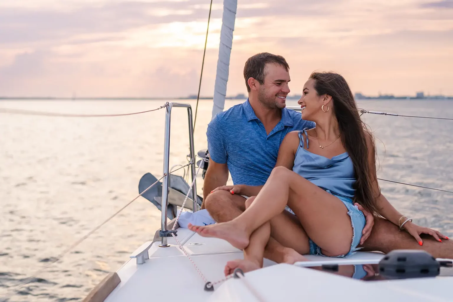 Couple on the bow of Esprit de Joy during a private sunset sail in Charleston
